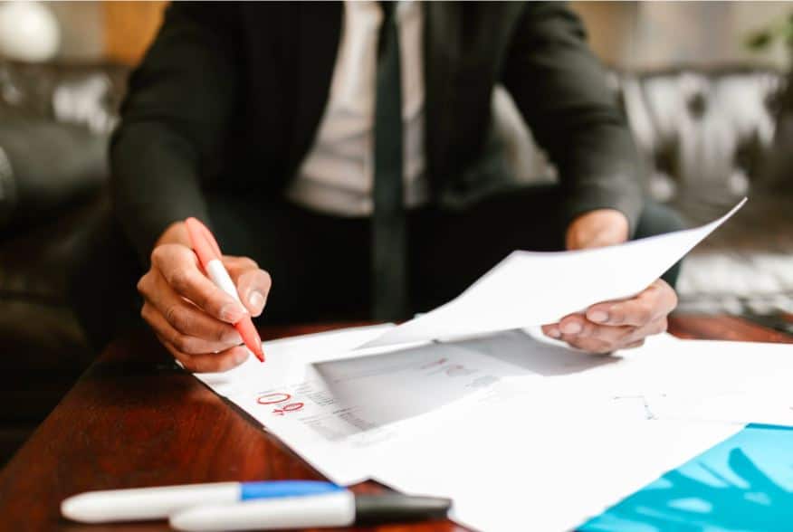 Man holding a pen and letter
