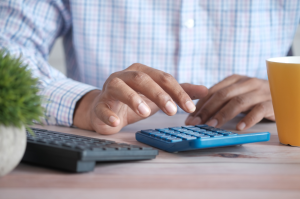 Man using calculator